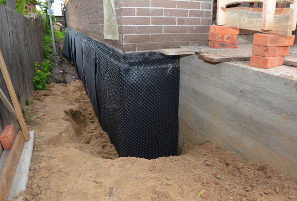 SJ Waterproofing Pros technician performing targeted Waterproofing assessment in Fords, NJ
